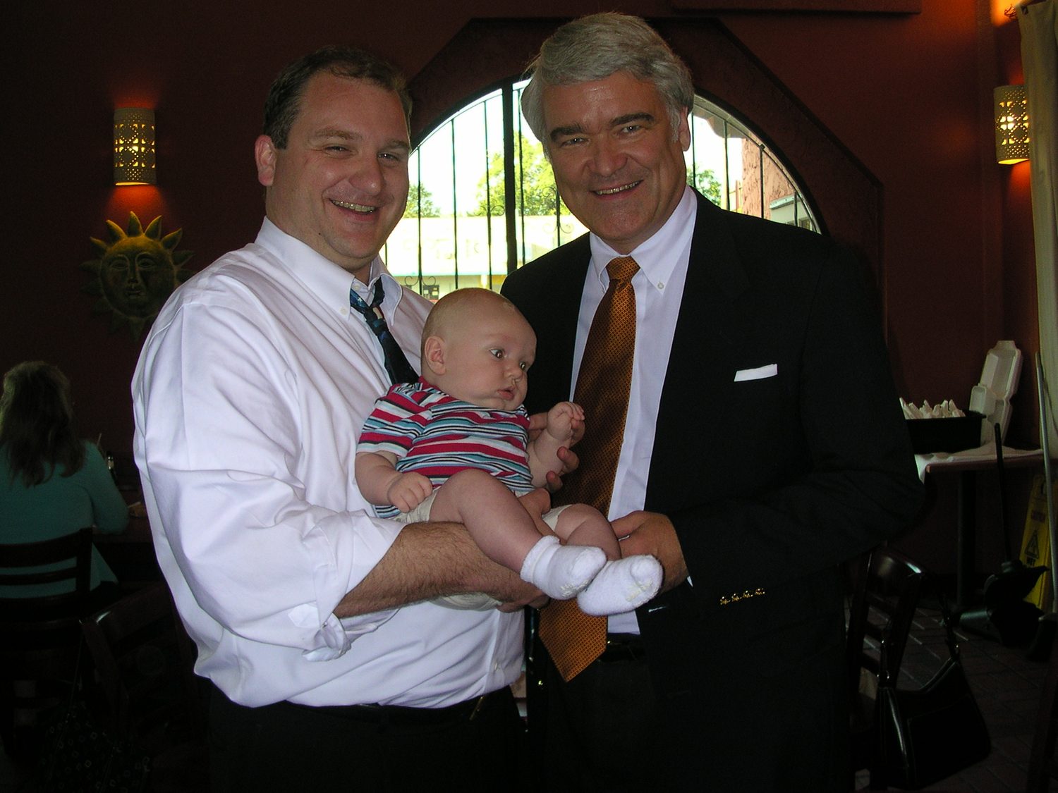 David Rogers and his son Jay with Texas Supreme Court Justice Nathan Hecht