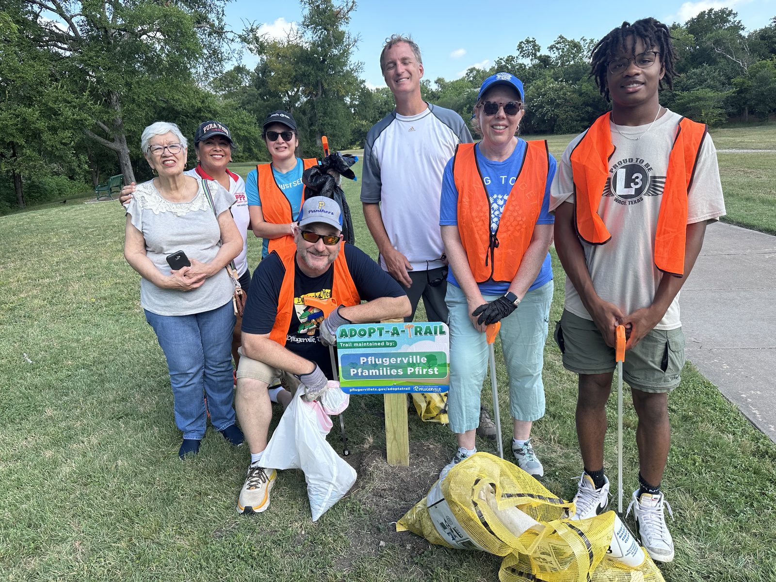 David Rogers volunteering at a Pflugerville park cleanup with Pfamilies Pfirst