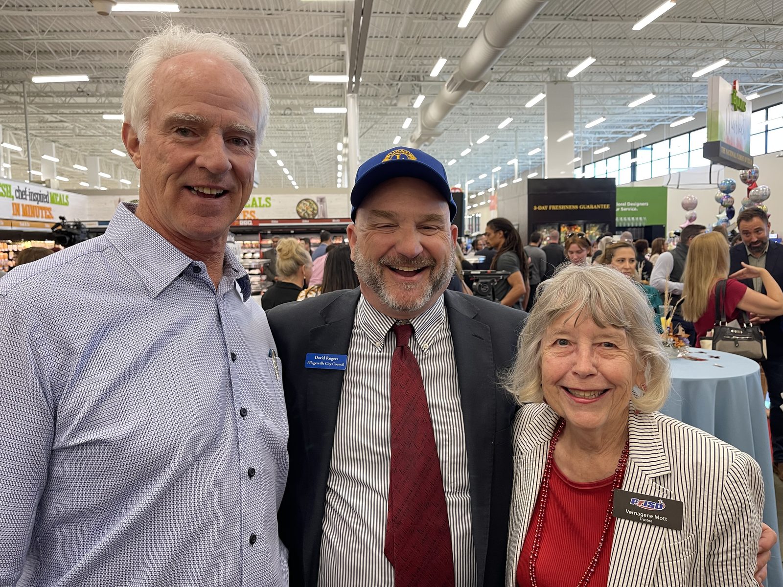David Rogers with PfISD Trustee Vernagene Mott at a Pflugerville store opening