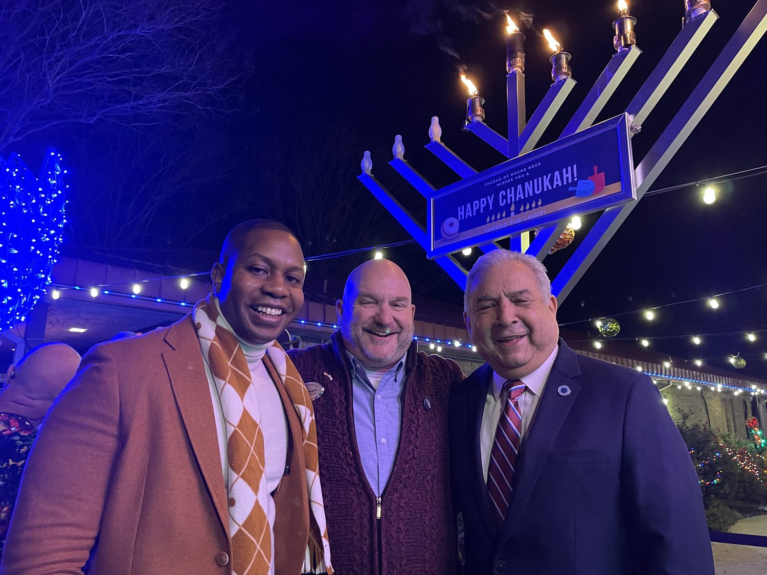 David Rogers at the Pflugerville Menorah lighting with Councilman Rudy Metayer and former Mayor Victor Gonzales