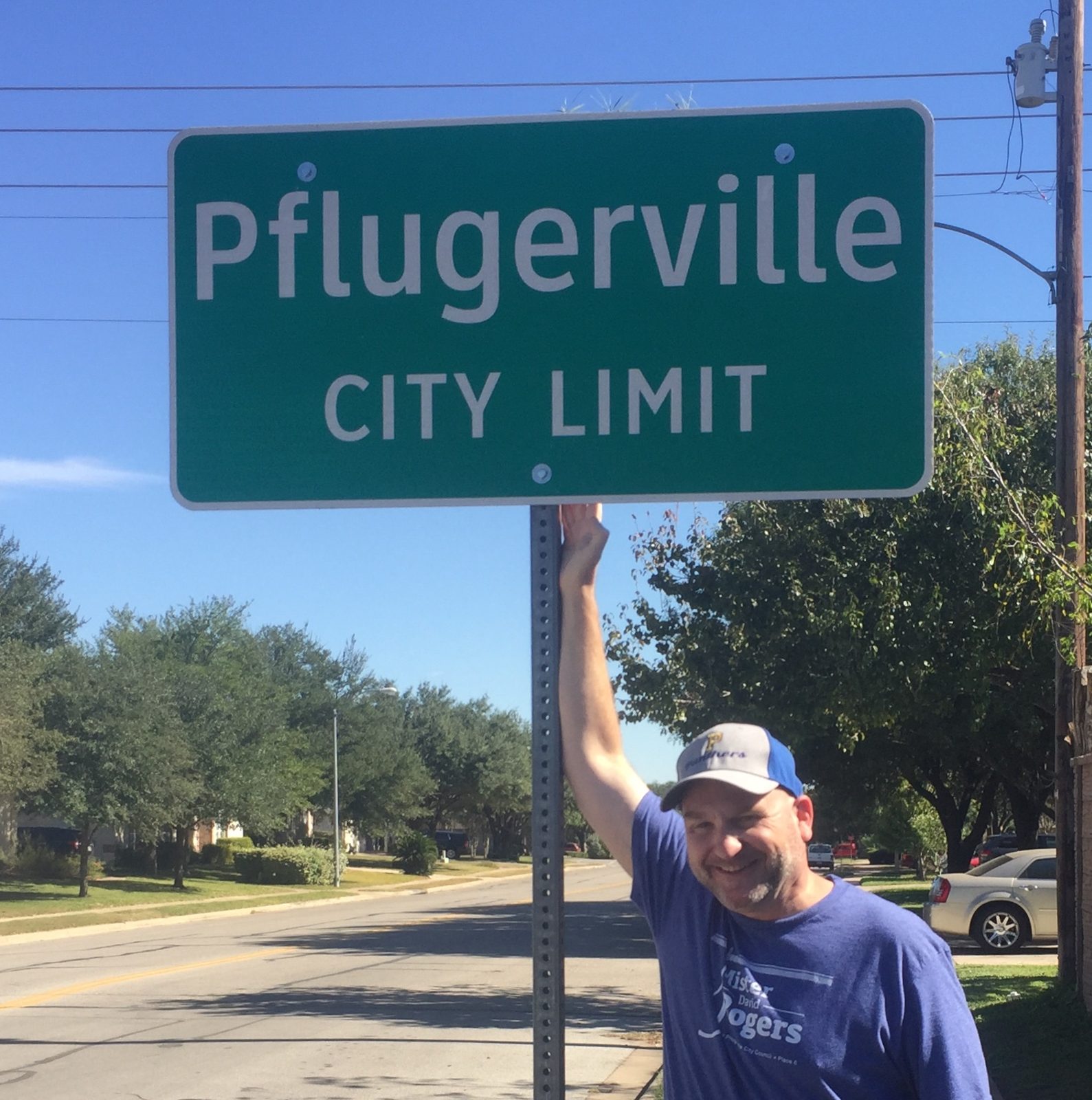 David Rogers at the Pflugerville city limit sign
