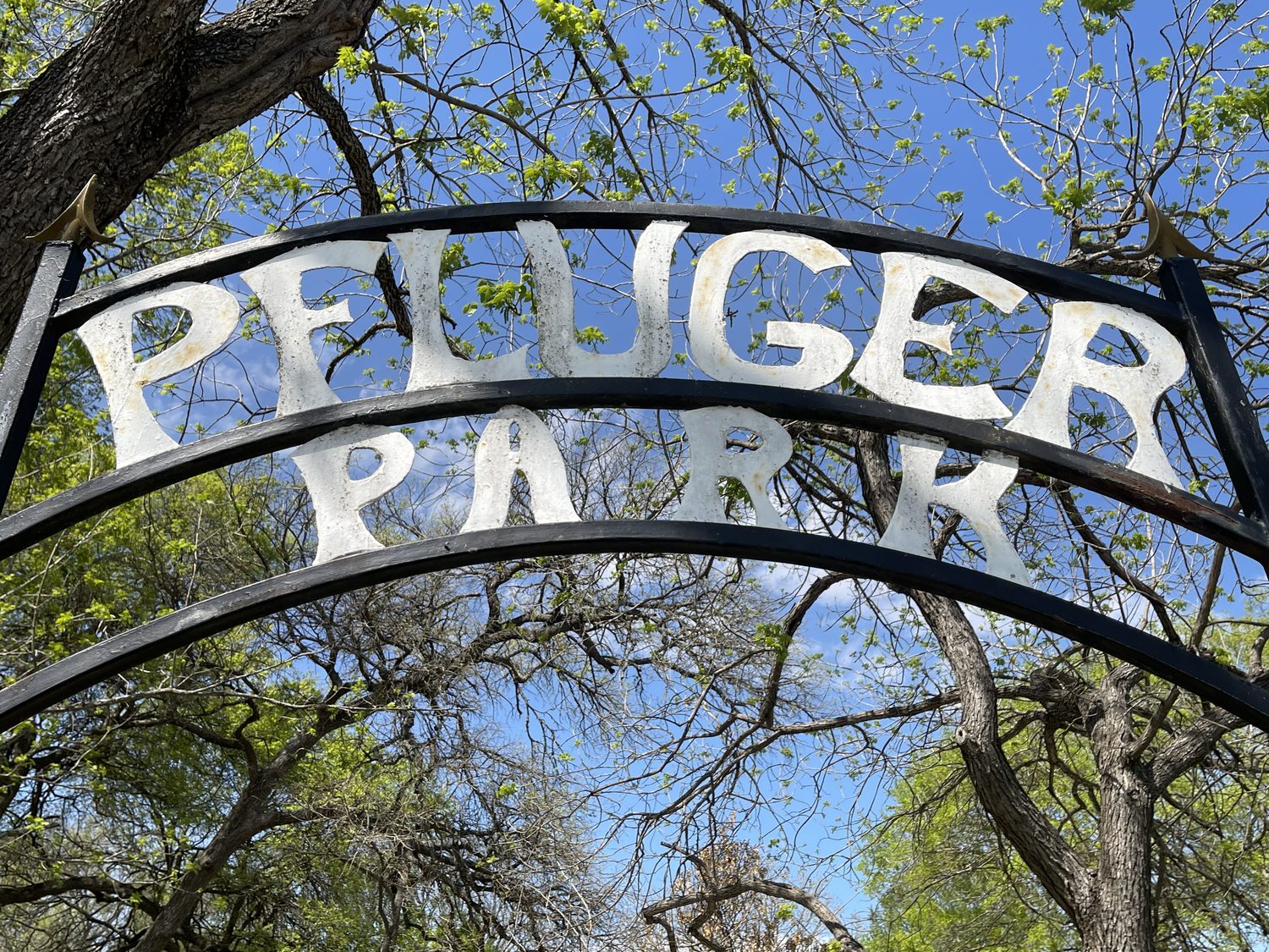 The wrought iron entrance sign at Pfluger Park in Pflugerville