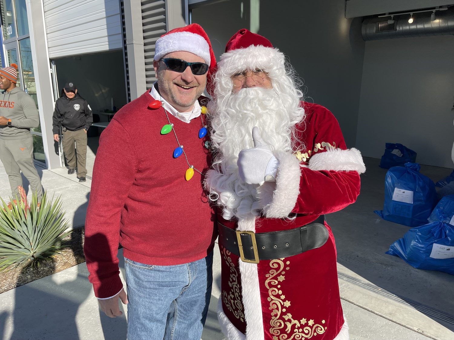 David Rogers with Santa at the Blue Santa toy giveaway