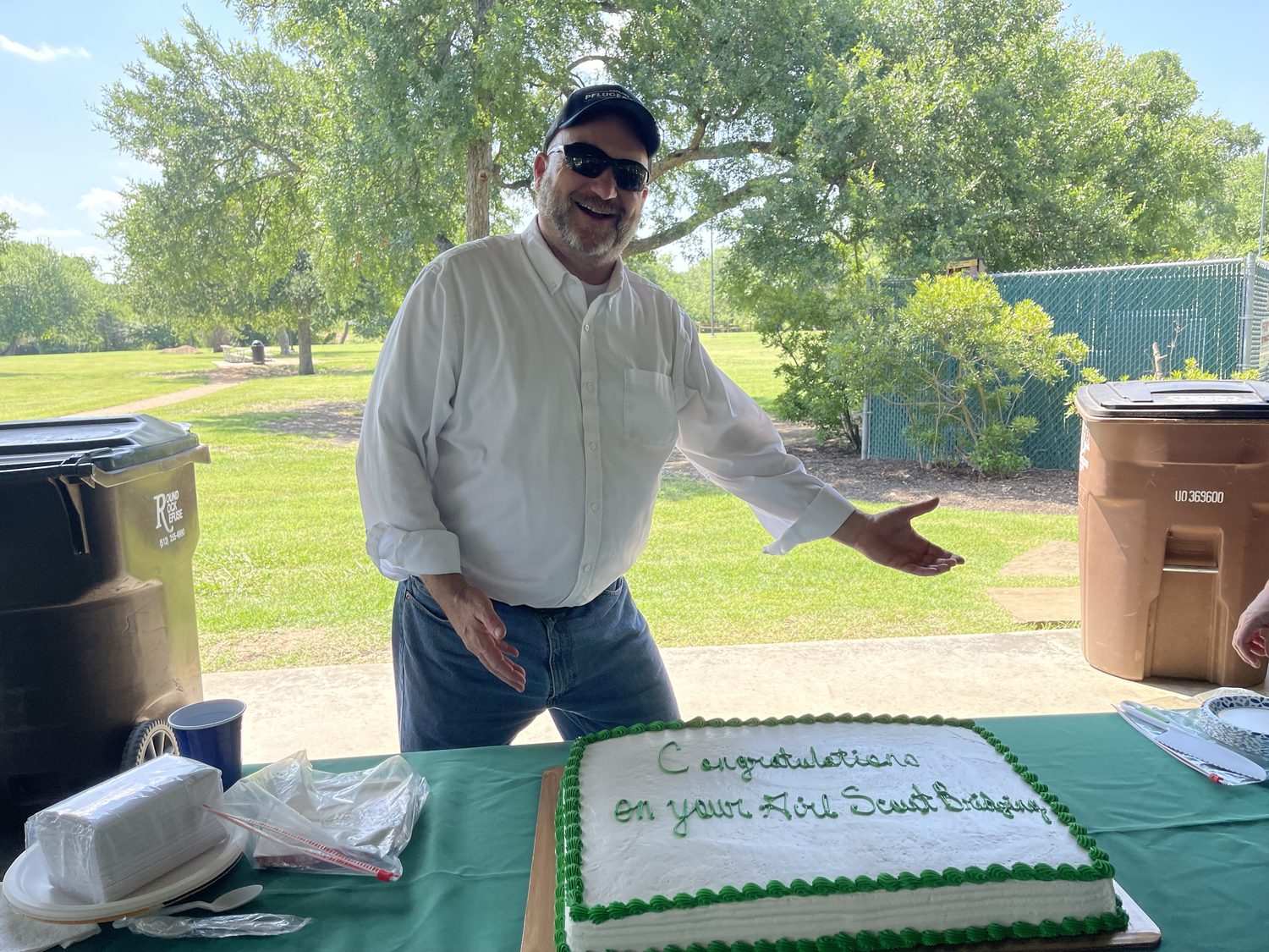 David Rogers with a Girl Scout bridging cake
